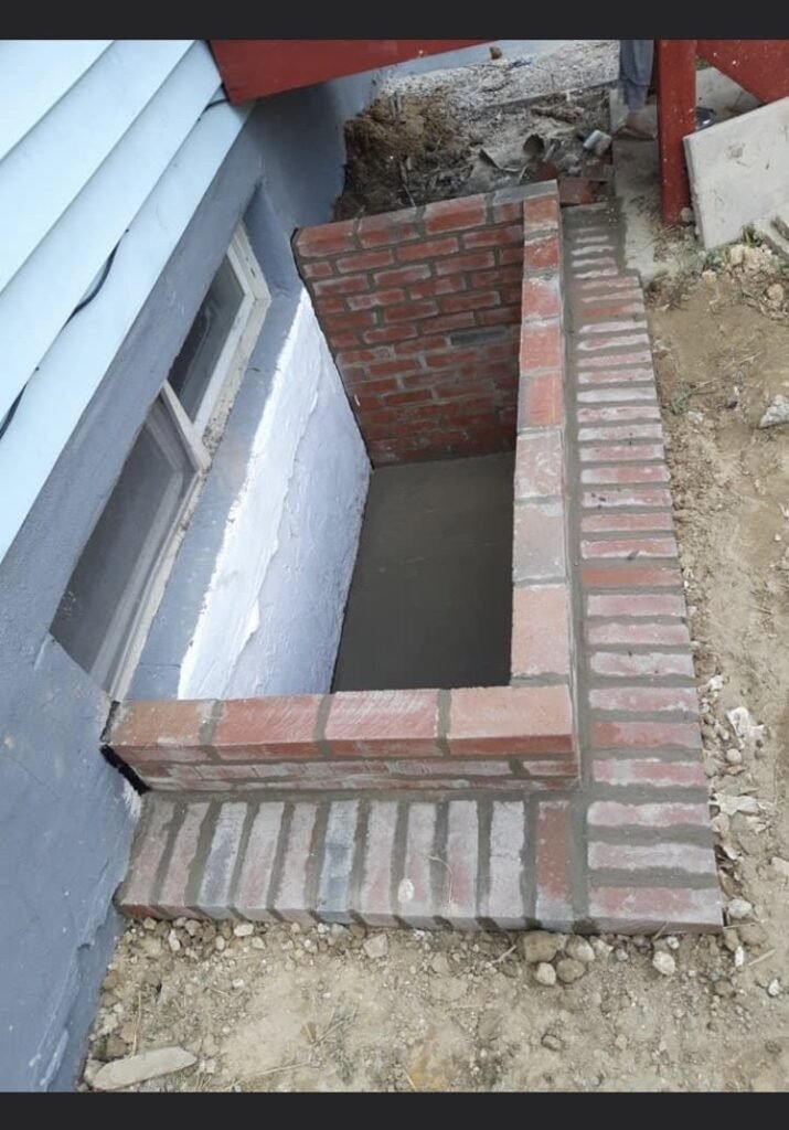 Brickwork around a below-grade window opening