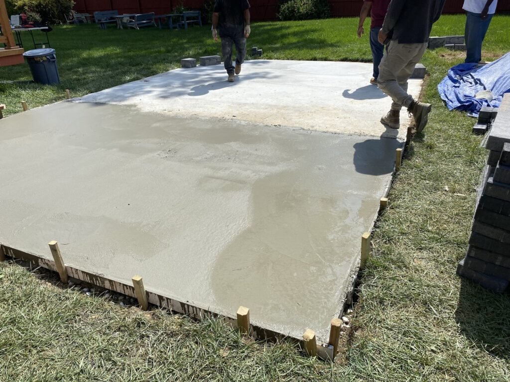 Concrete surface being placed and finished outdoors