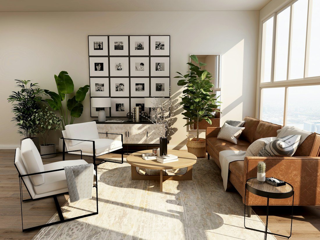 Sala luminosa con tonos cálidos, plantas y materiales naturales, como referencia de acabados